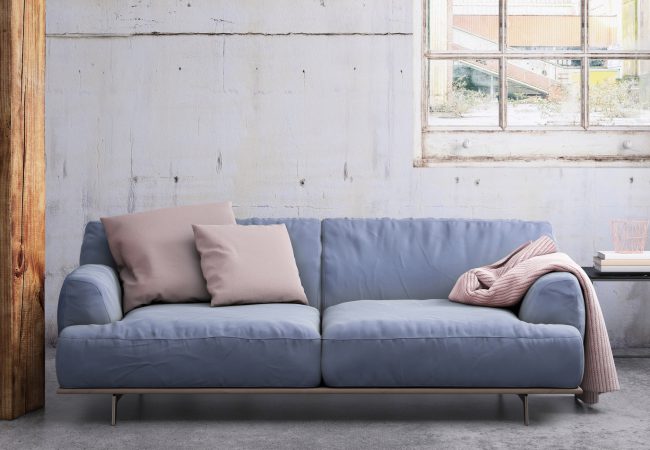 Pastel colored sofa with blank wall template